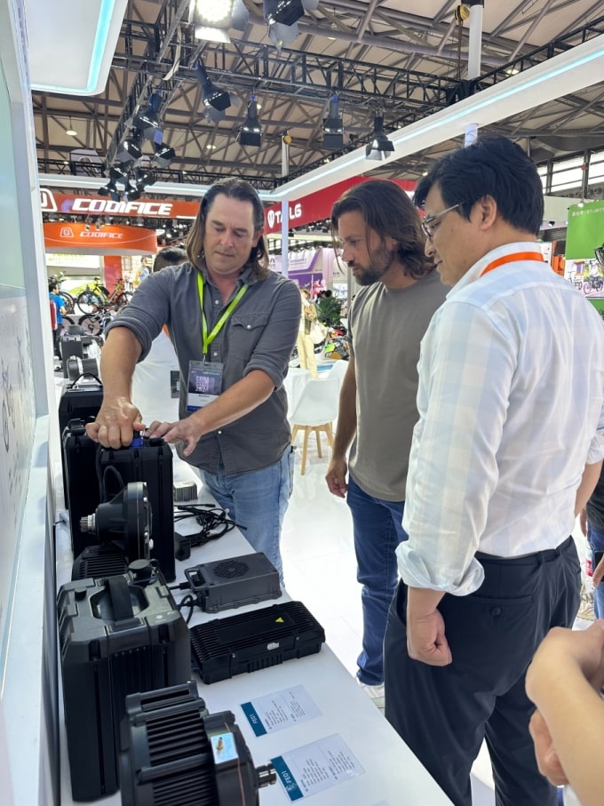 Booth visitors inspect components